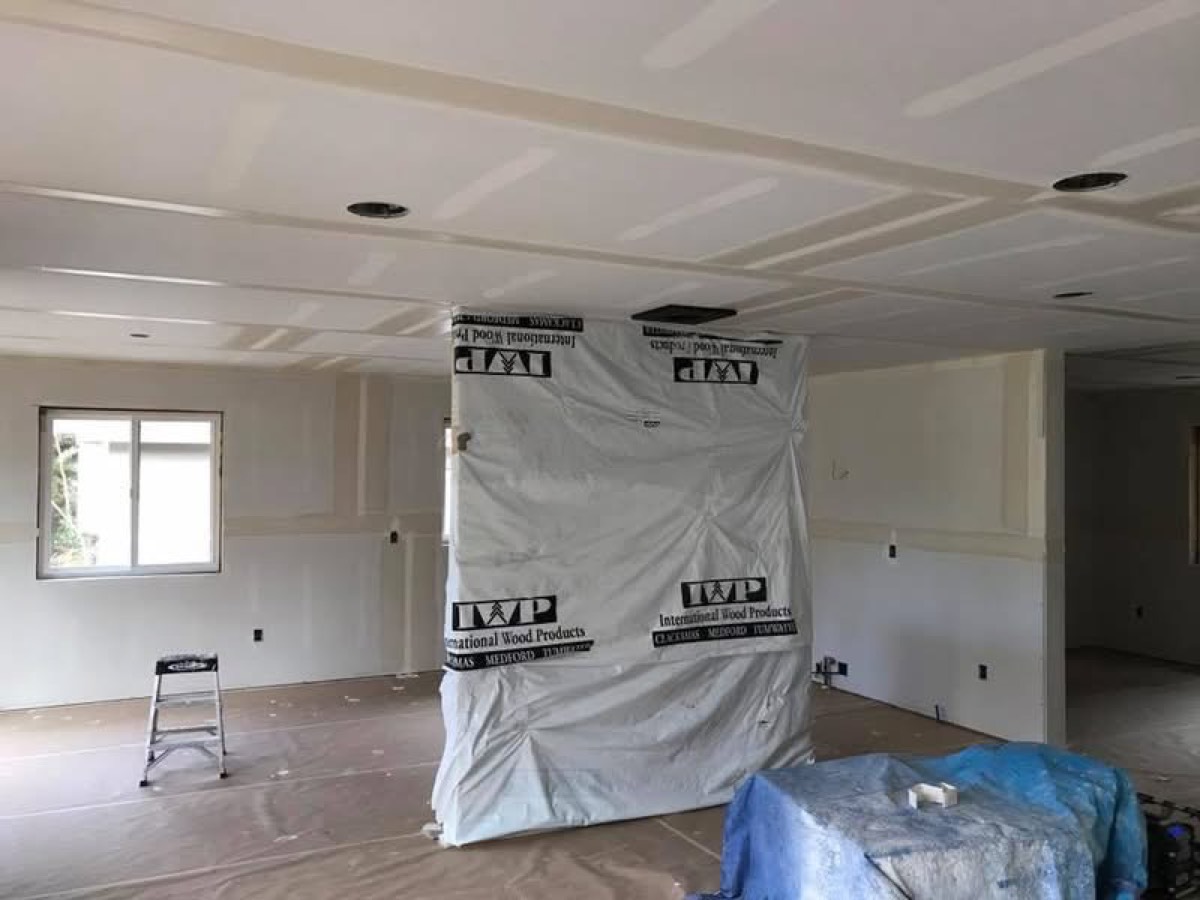 Finished drywall with built-in cabinetry protected during work, Jefferson County WA