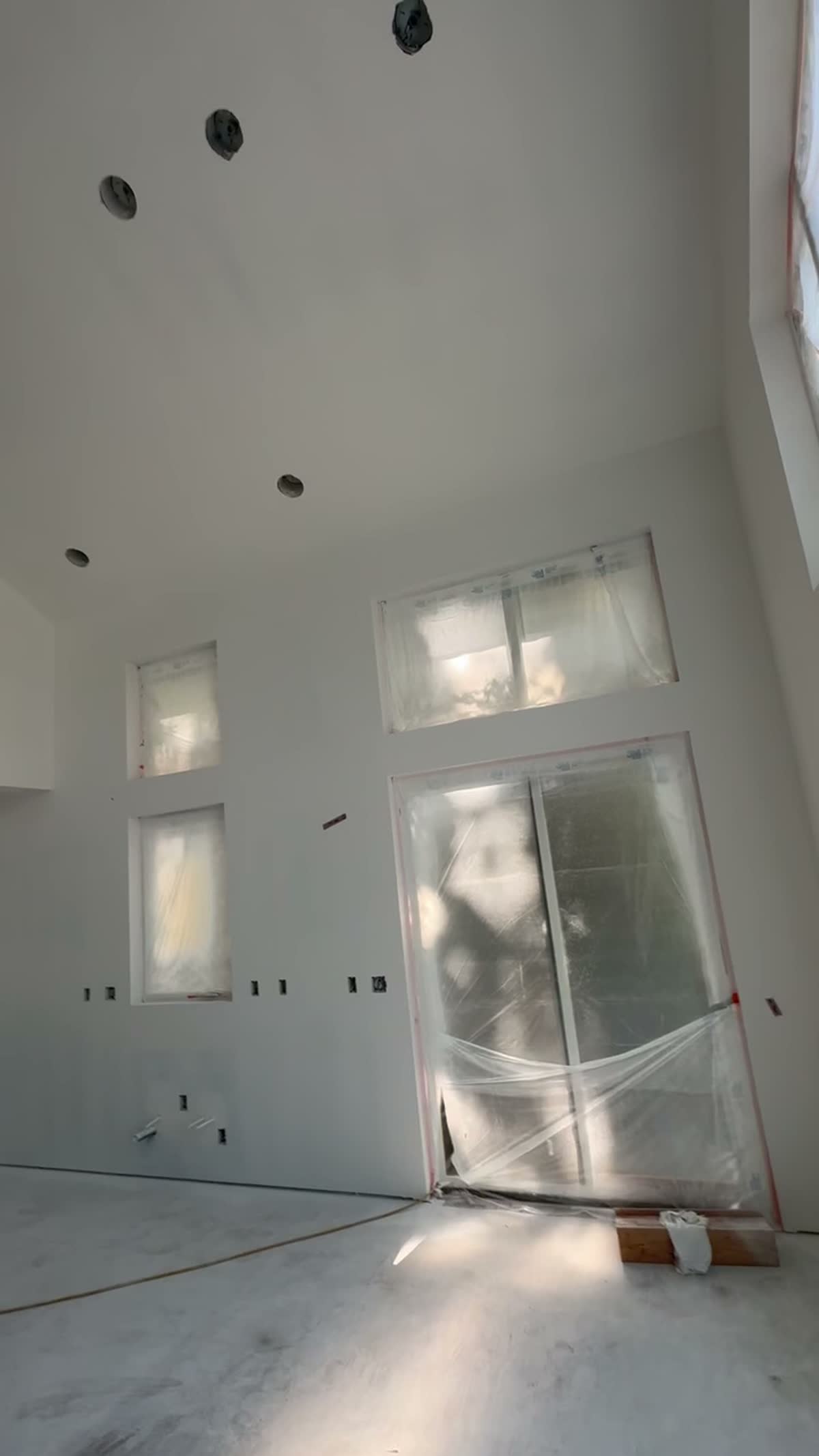Two-story wall with smooth Level 5 finish, Olympic Peninsula new construction
